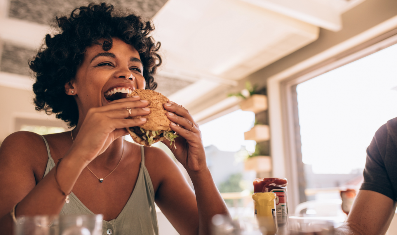 Woman eating sandwich